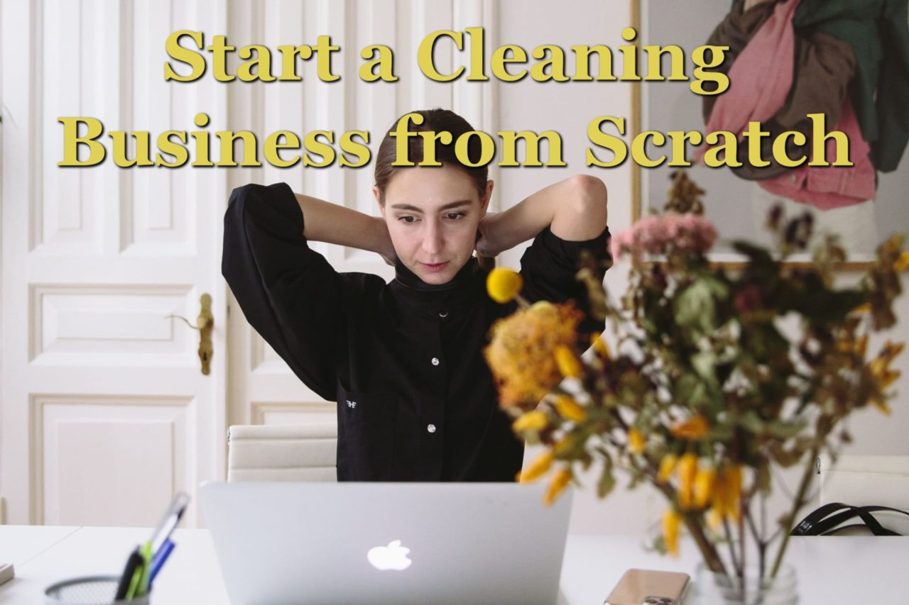 A woman at a computer getting ready to start a cleaning business from scratch